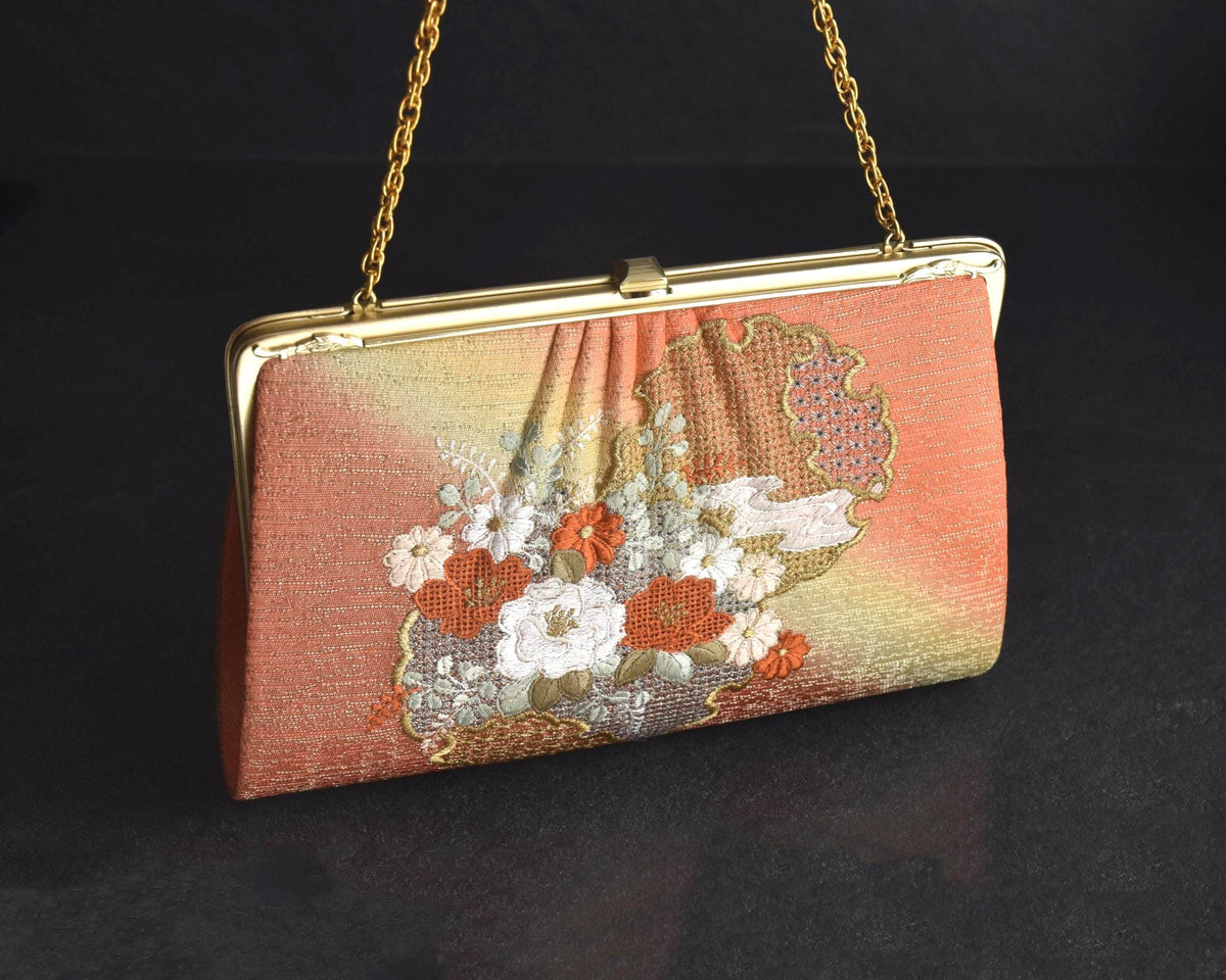 Floral Woven Kimono Clutch shown from the front with floral embroidery and gold frame