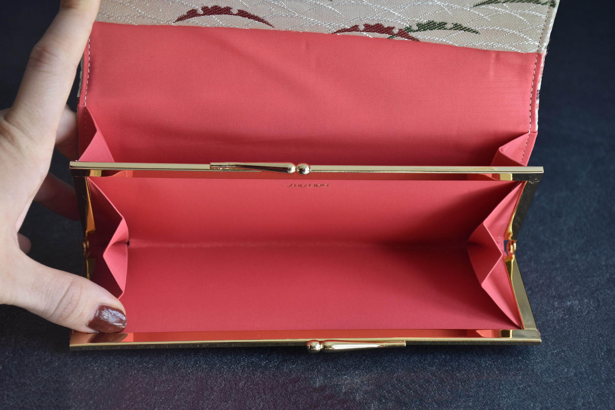 Shiseido Japanese Kimono Clutch With Traditional Weaves open view showing coral fabric lining