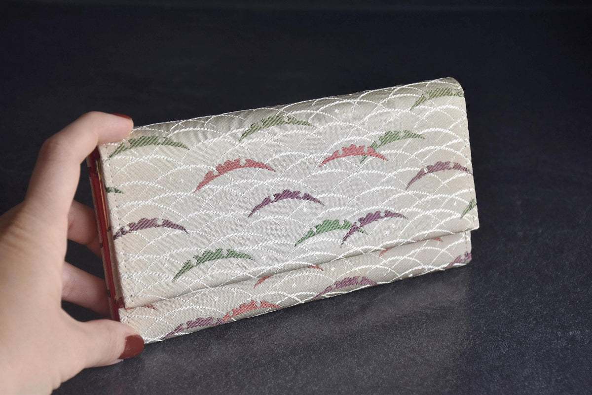 Shiseido Japanese Kimono Clutch With Traditional Weaves held in hand