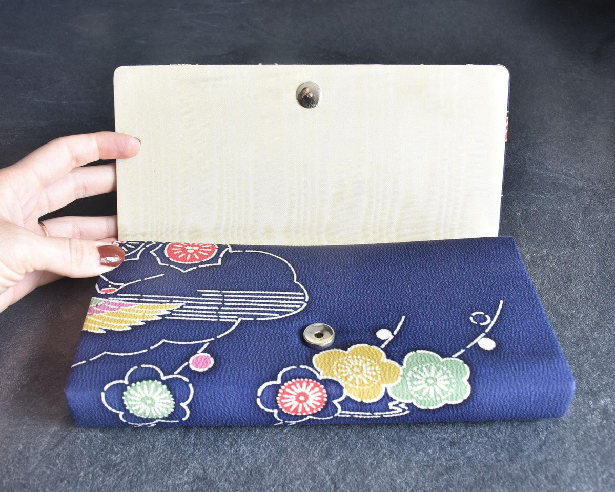Navy Chirimen Kimono Clutch With Tsuru Crane Motif open showing satin lining and magnetic snap