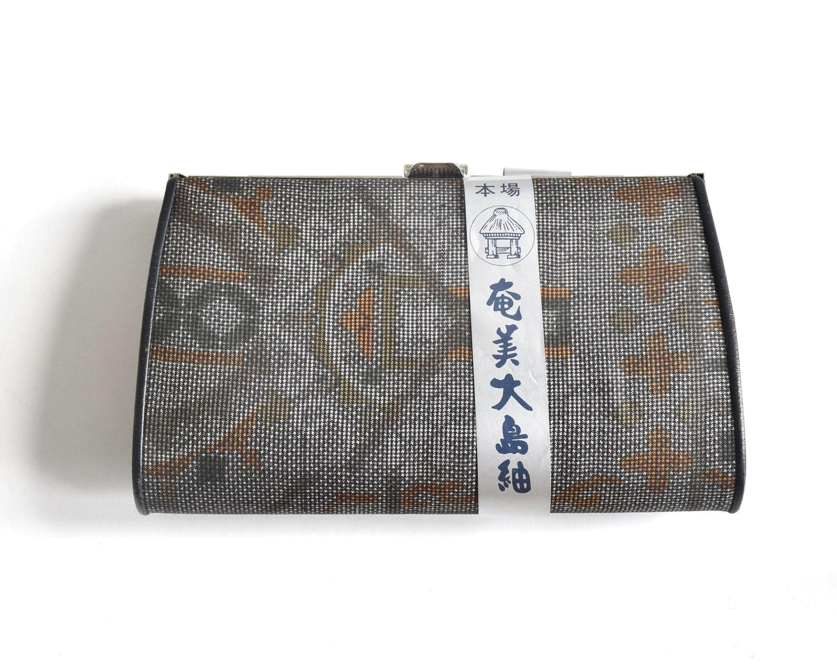 Amami Oshima Tsumugi silk clutch front design with intricate pattern detail