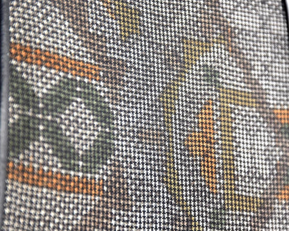 Amami Oshima Tsumugi silk clutch close up showing woven geometric pattern