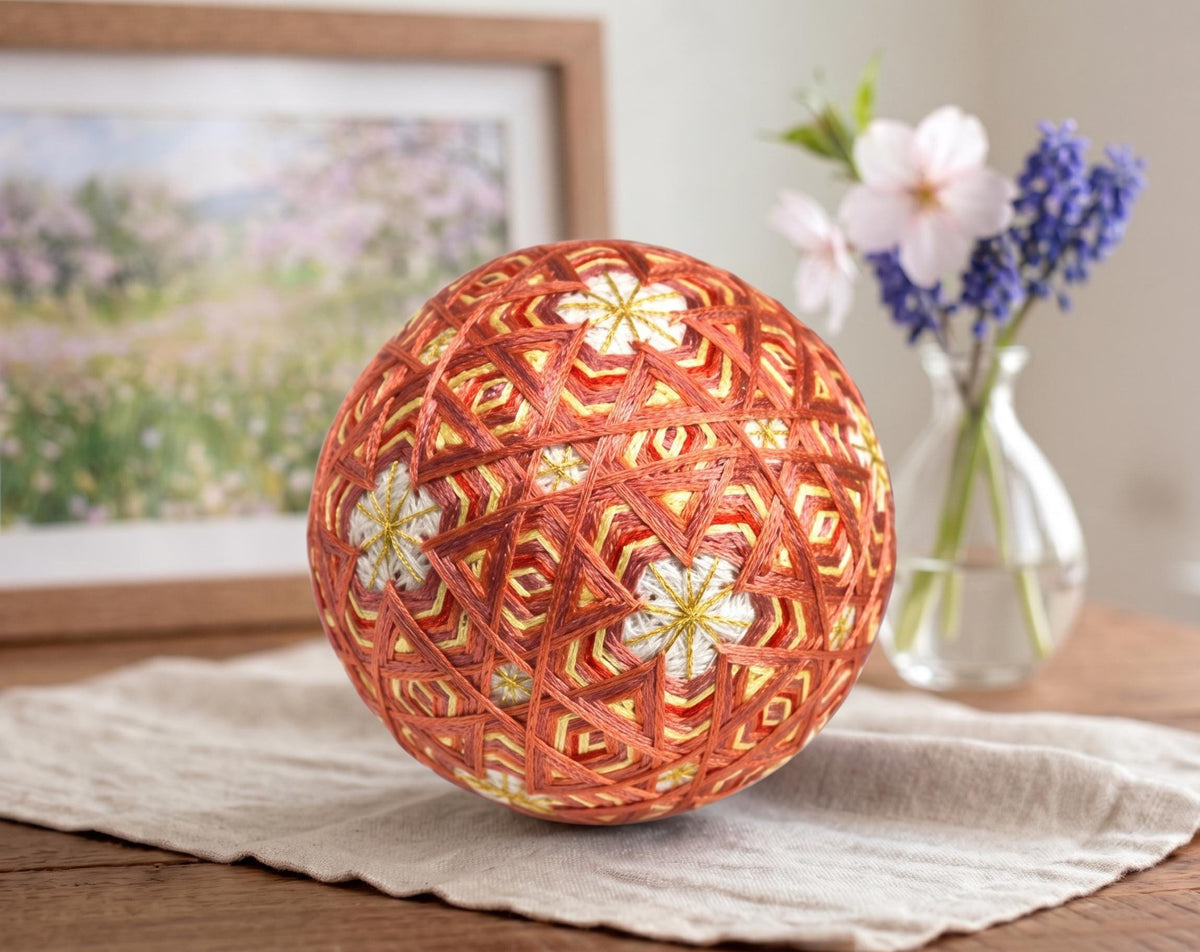 Hand-Embroidered Japanese Temari Ball Folk Art table scatter displayed on cloth with flowers and framed art