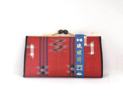 Ryukyu Kasuri Geometric Ikat Silk Wallet Red front view showing the label band and clasp