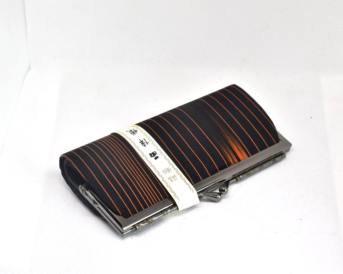 Nishijin-Ori Silk Gamaguchi Purse Black Copper Stripe angled view showing the clasp