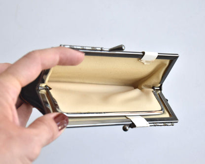 Nishijin-Ori Silk Gamaguchi Purse Black Copper Stripe interior view held in hand