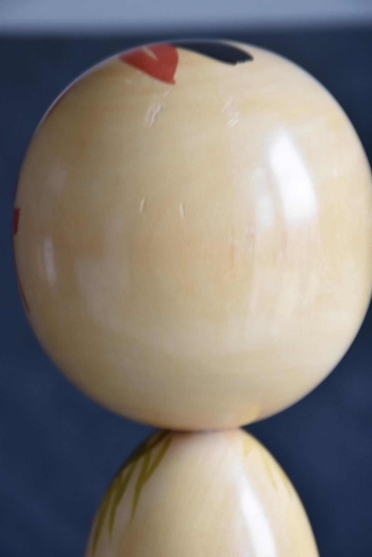 Pair of Japanese kokeshi dolls bamboo and floral motif head top view