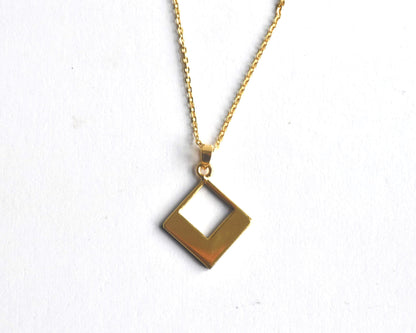 Floral Zogan Damascene Inlay Gold Necklace hanging pendant viewed from a slight angle