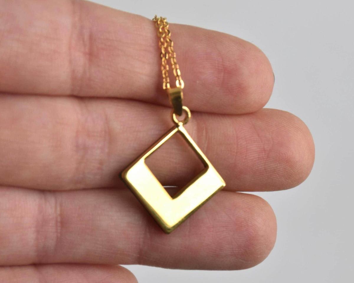 Floral Zogan Damascene Inlay Gold Necklace showing the plain back of the pendant