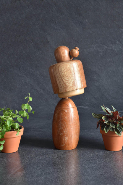 Masuo Sato kokeshi doll angled view featuring the tilted bob hairstyle
