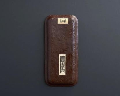 Ikkanbari Papier-Mache Serving Tray back showing textured brown base and labels