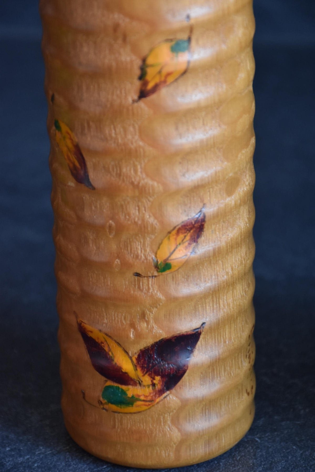 Usaburo sosaku kokeshi pattern detail showing textured wood carving
