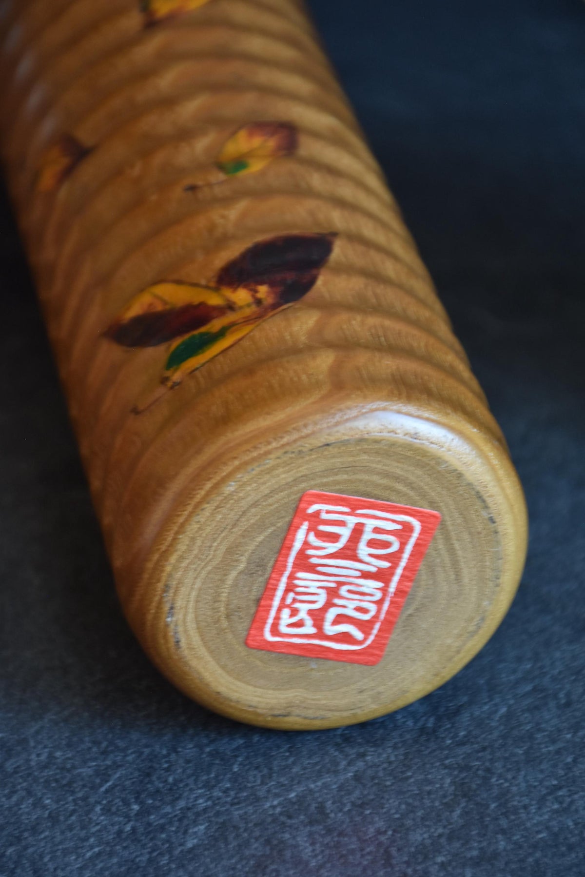 Usaburo sosaku kokeshi base with red maker signature stamp label
