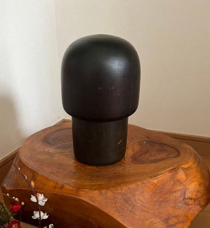 Sansaku Sekiguchi sosaku kokeshi doll showing the plain black back of the smooth wooden head and body