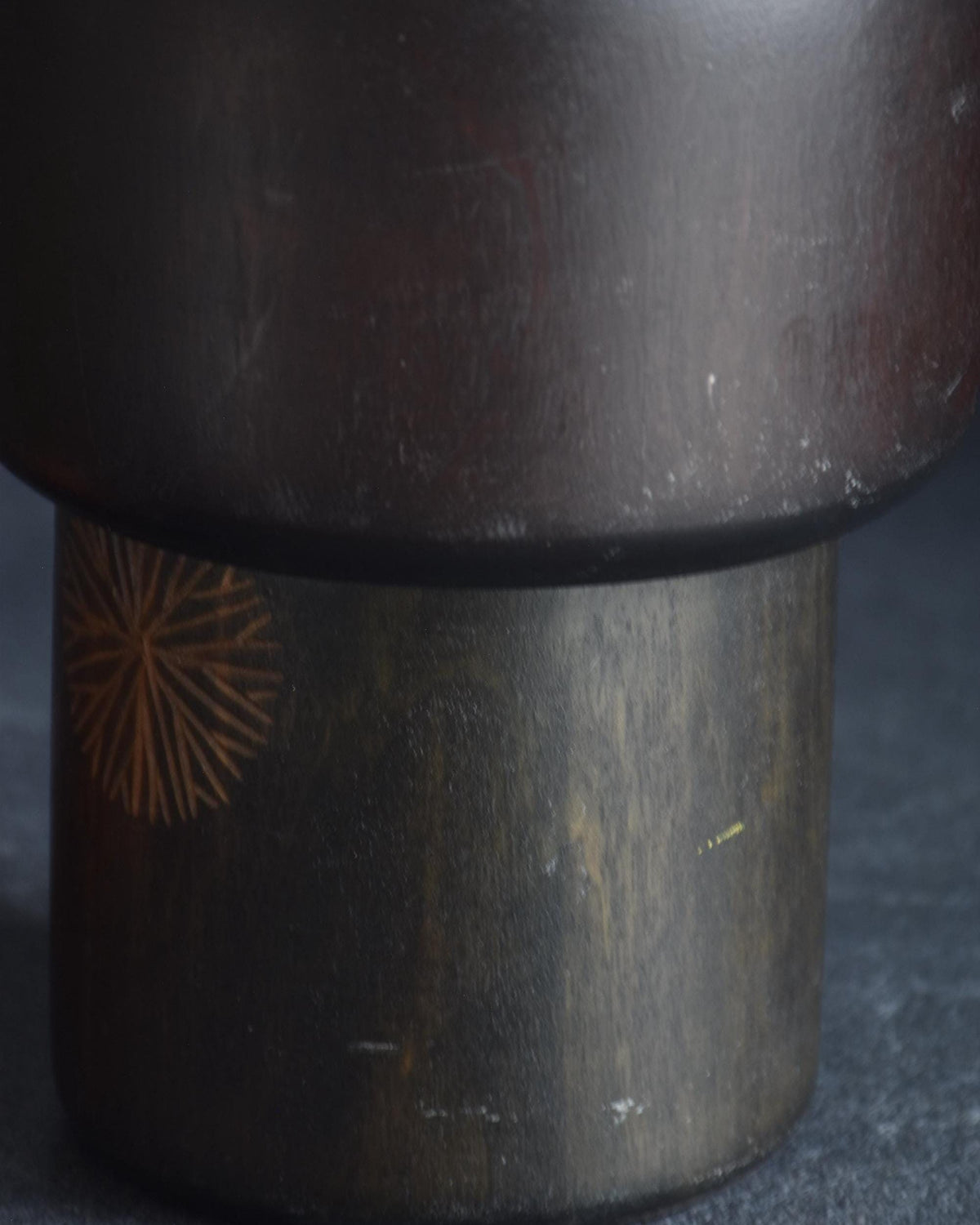 Sansaku Sekiguchi sosaku kokeshi doll, detail of the dark finish on the upper body