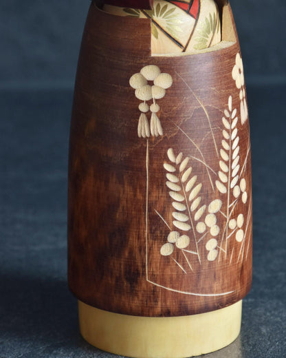 Sato Suigai Sosaku kokeshi doll Shijo close up of carved grain stalk and floral tassel details