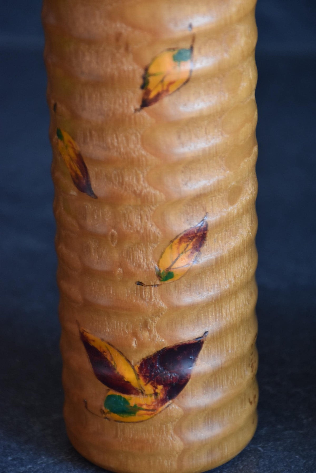 Usaburo sosaku kokeshi pattern detail of hand-painted autumn maple leaves