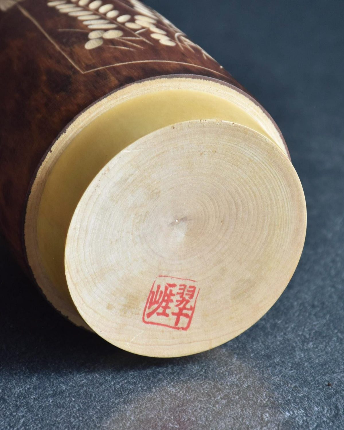 Sosaku Kokeshi Shijo by Sato Suigai showing the wooden base with artist signature stamp