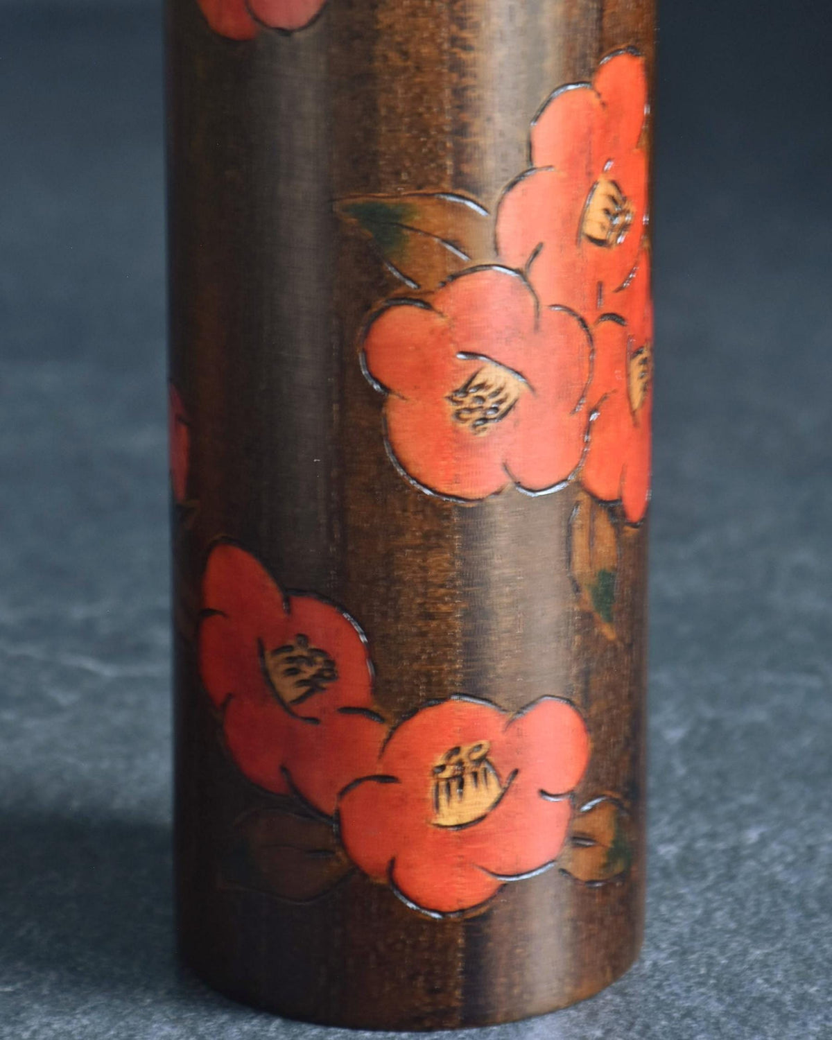 Ryozo Tsujita kokeshi doll lower body showing additional painted red camellia flower details