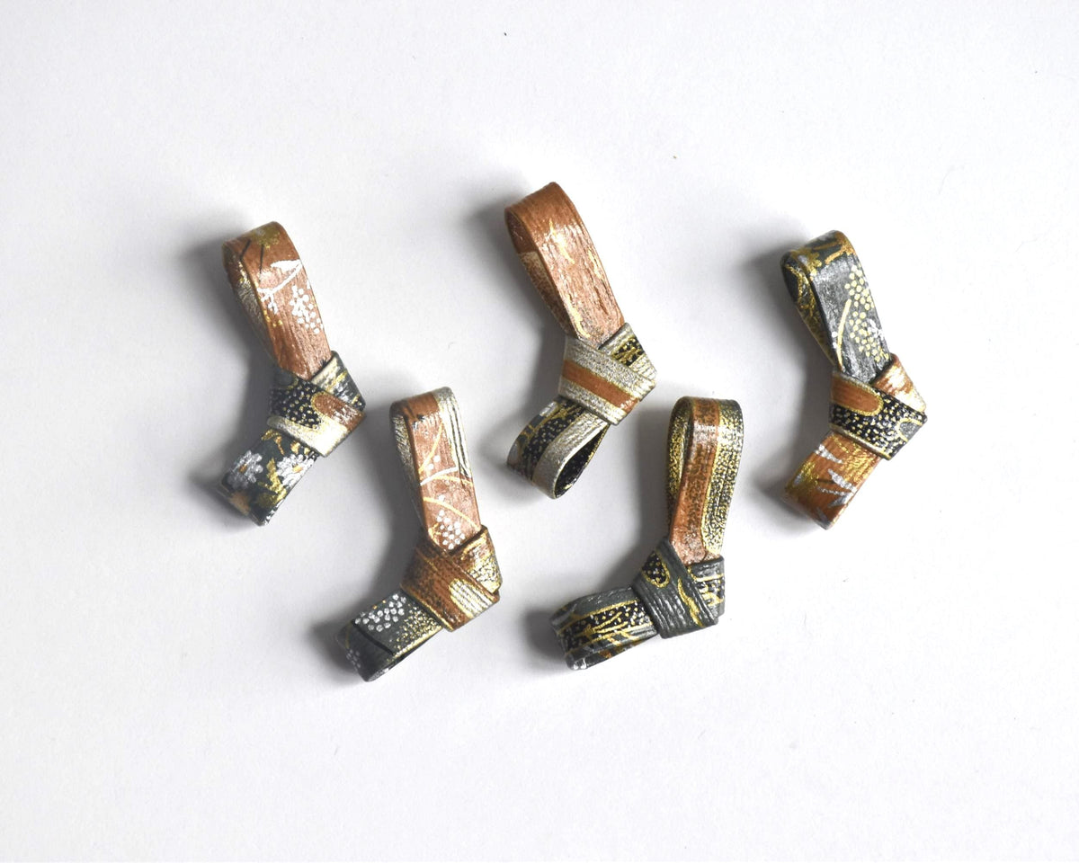Japanese Washi Paper Chopstick Rests Red Kimono set of five hashioki laid out on a white surface