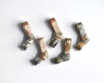 Japanese Washi Paper Chopstick Rests Red Kimono set of five hashioki laid out on a white surface